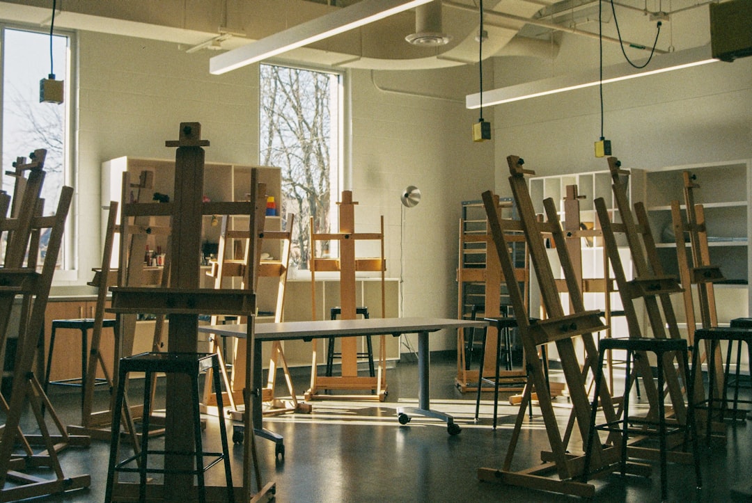 An empty art studio with easels awaits.