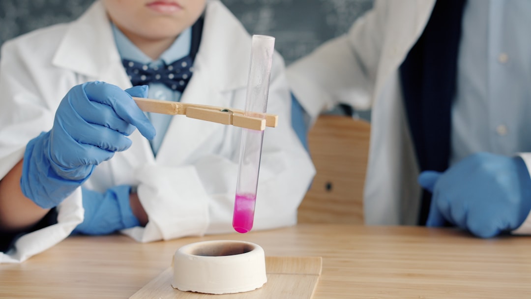 Children in lab coats conduct a science experiment.