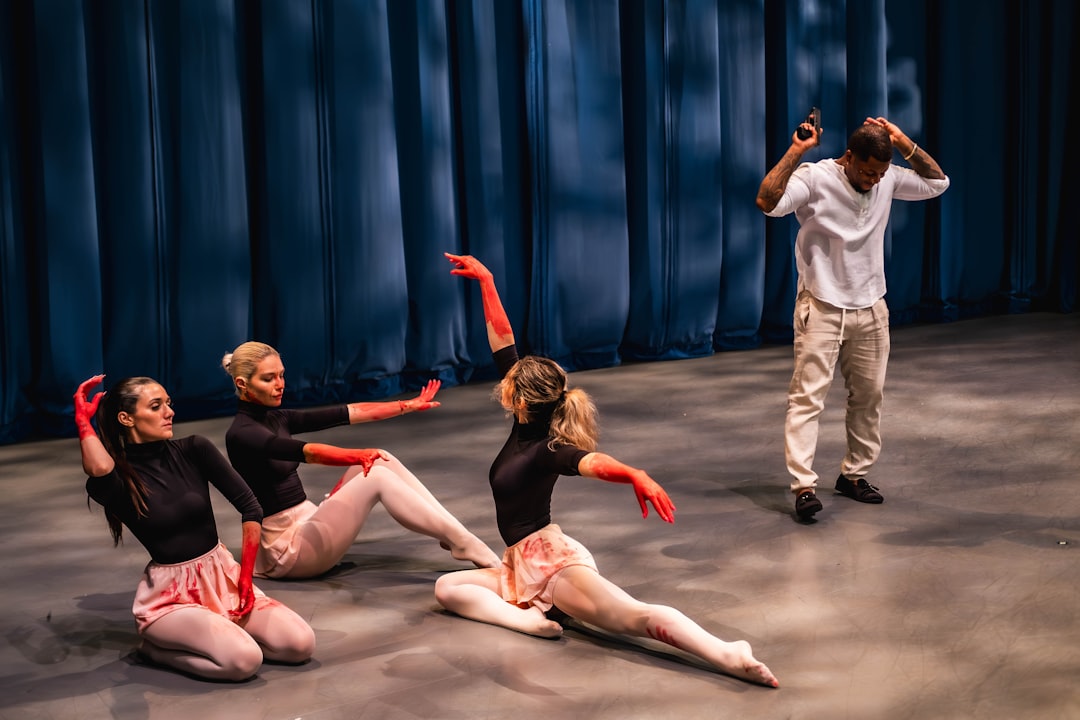 A group of dancers are performing on a stage
