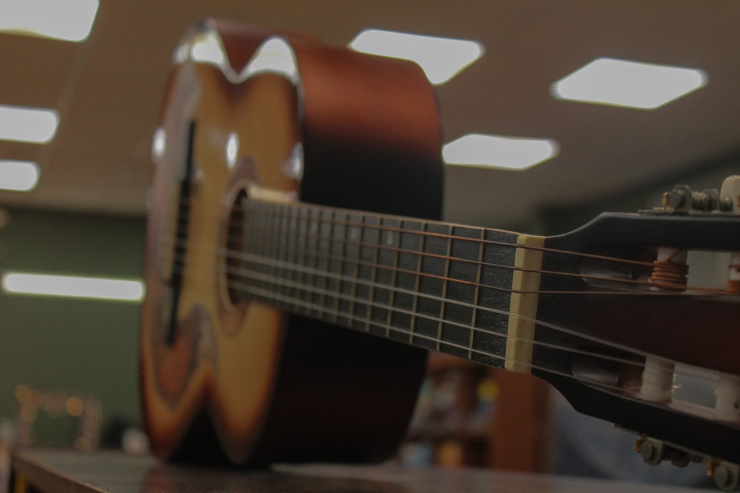 Acoustic guitar with brown and tan wood