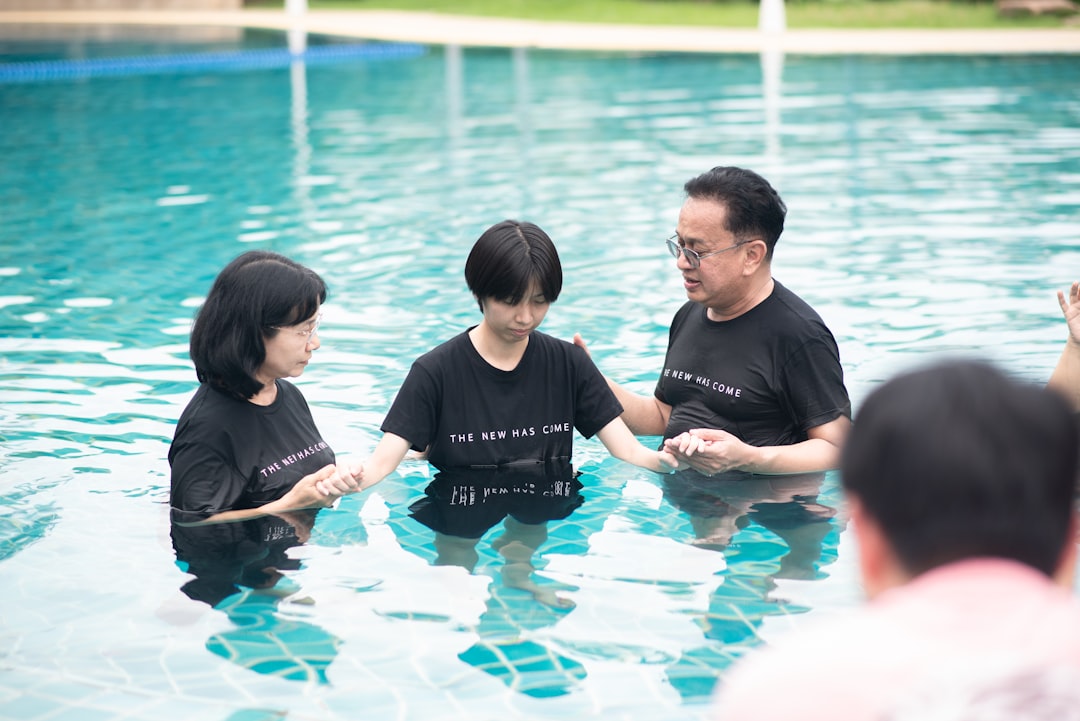 A group of people standing in a pool of water