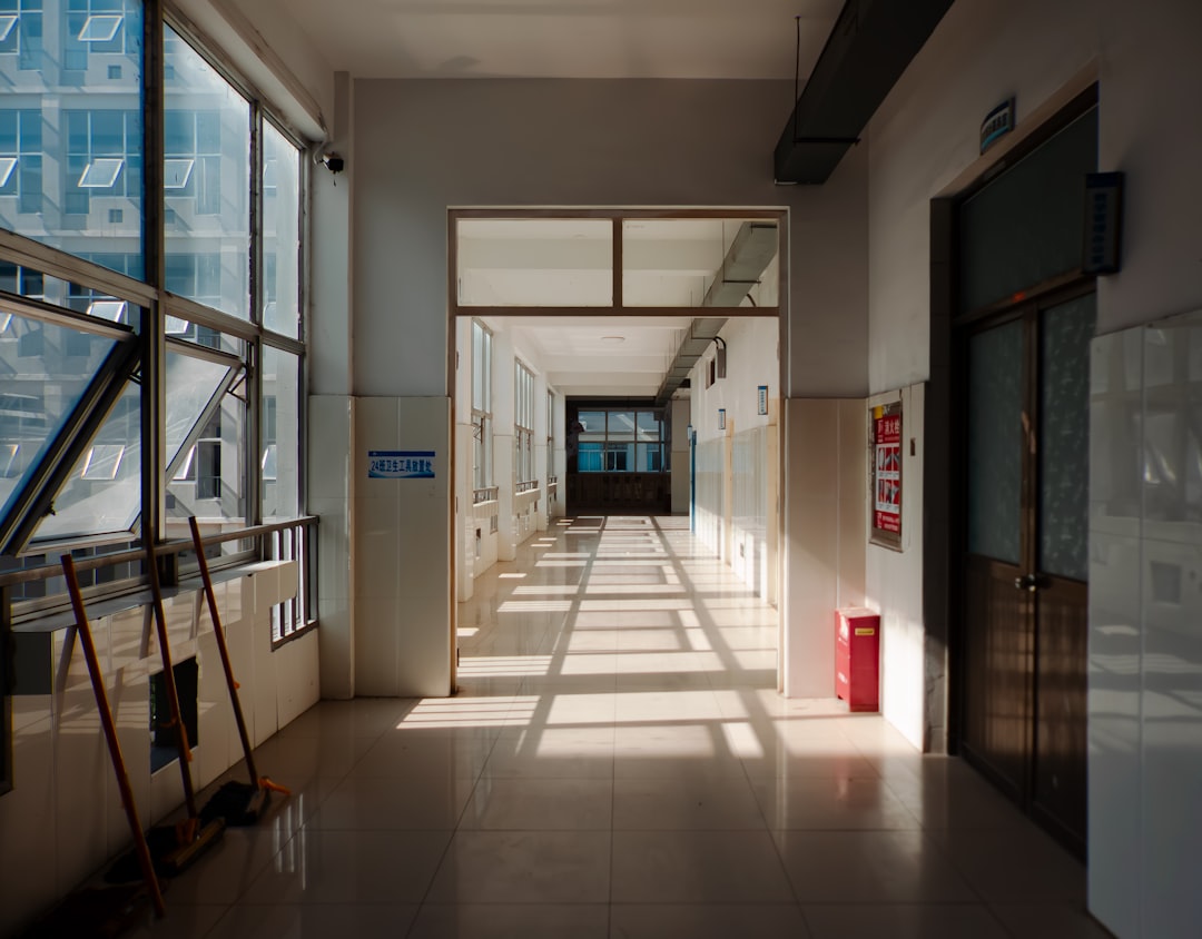 Long hallway with sunlight creating shadows.