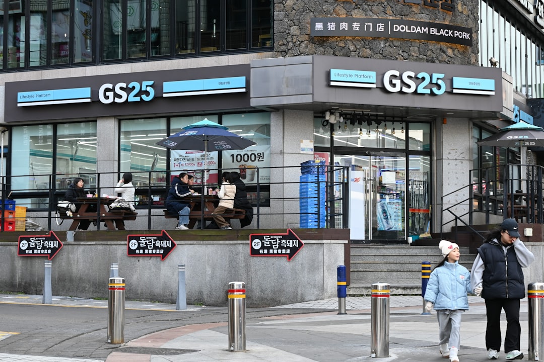 People sitting outside a gs25 convenience store.