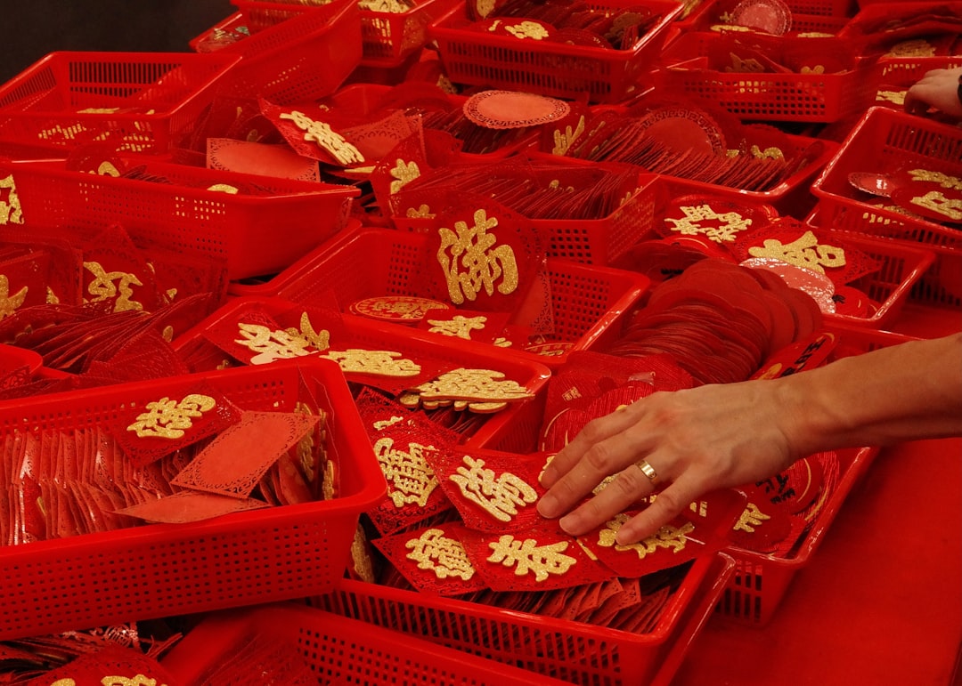 Red trays with gold chinese characters and hand