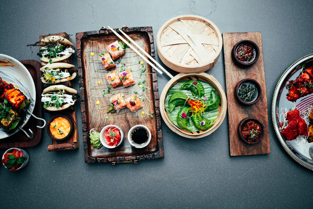 A table topped with plates and bowls of food