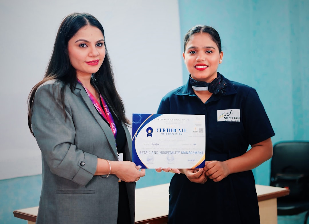 Two women holding a certificate