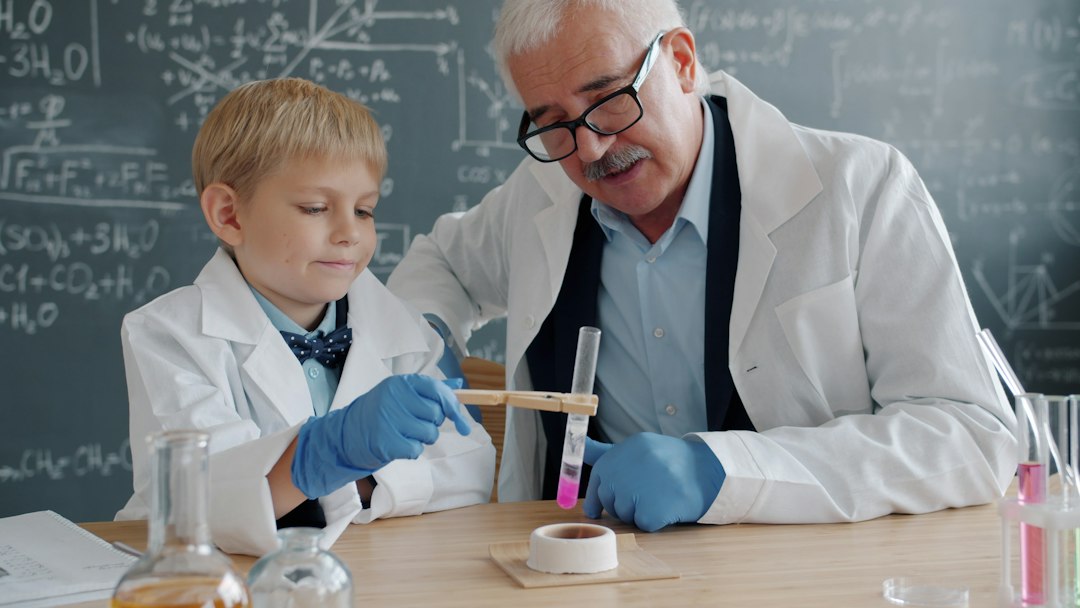 Scientist and child conduct experiment in laboratory