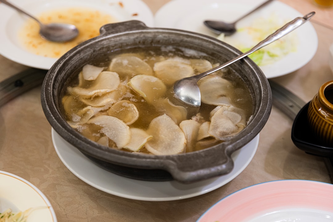 A hot pot dish with sliced radishes and broth.