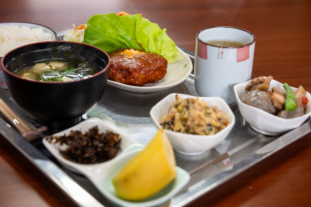 A silver tray topped with bowls of food