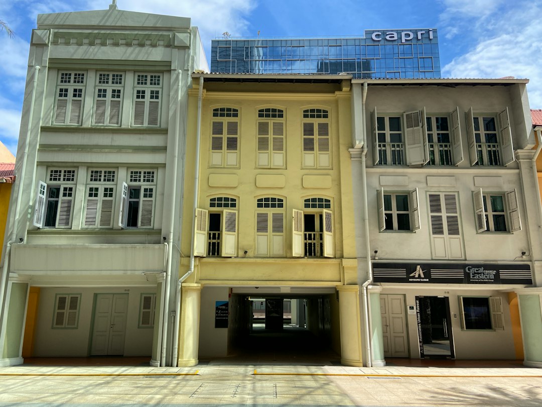 A group of three buildings sitting next to each other
