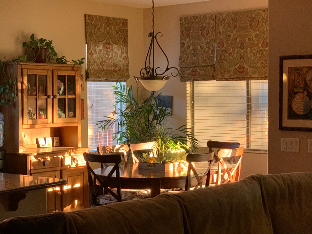 a living room filled with furniture and a dining room table