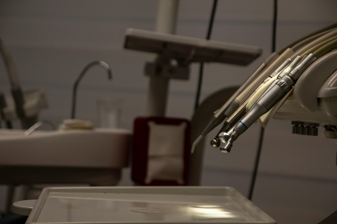 a dental room with a sink and dental equipment