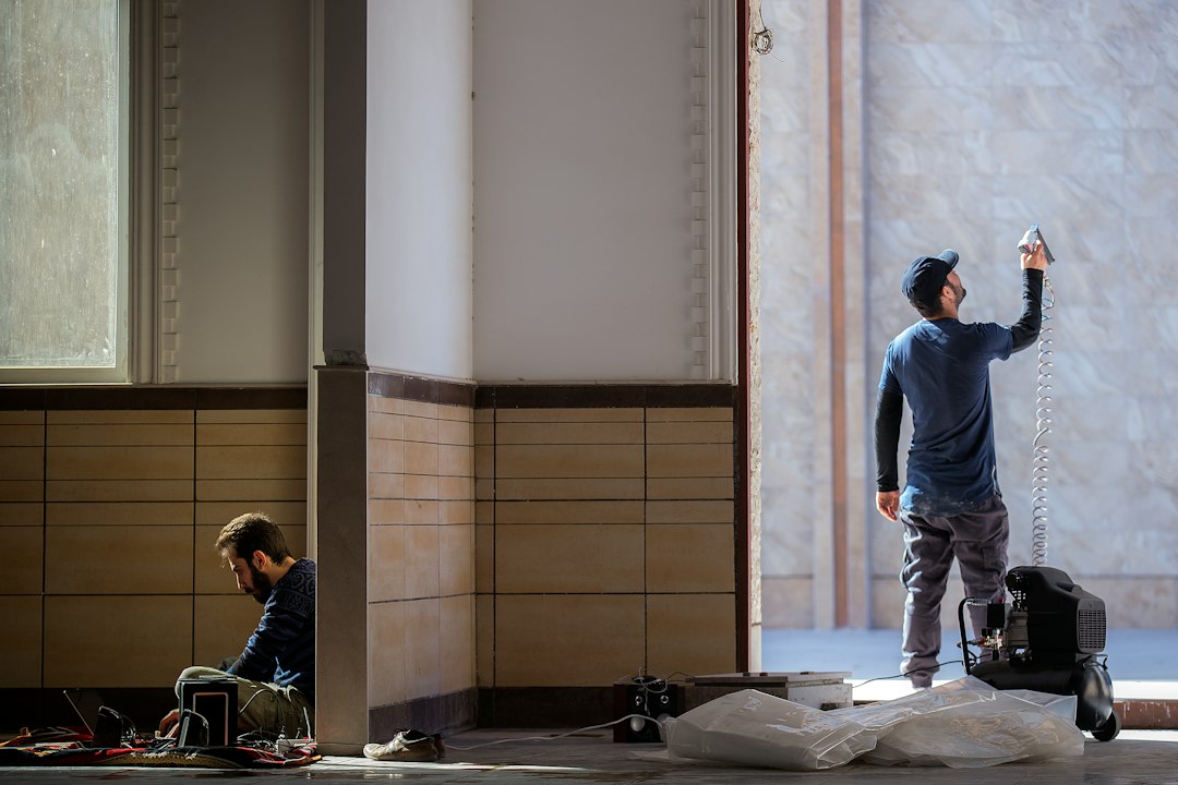 two men repairing the house