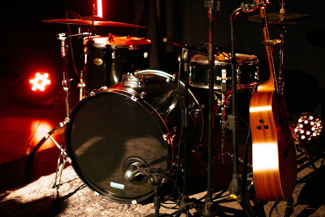 Drum set and acoustic guitar on stage