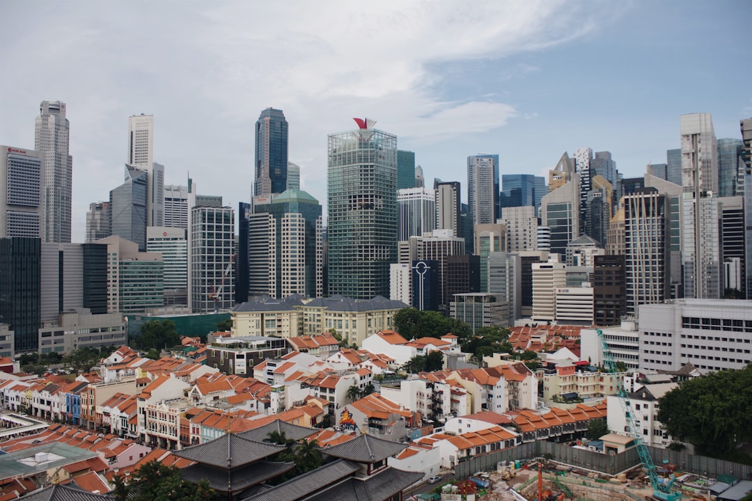 houses near high-rise buildings during daytime