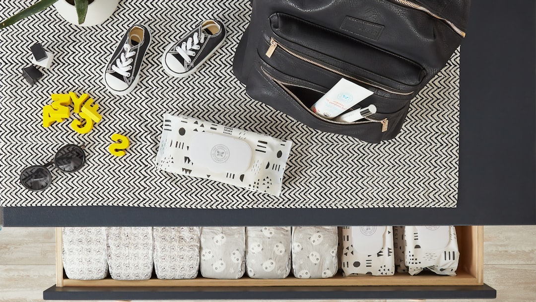 a black and white table with a black bag and shoes