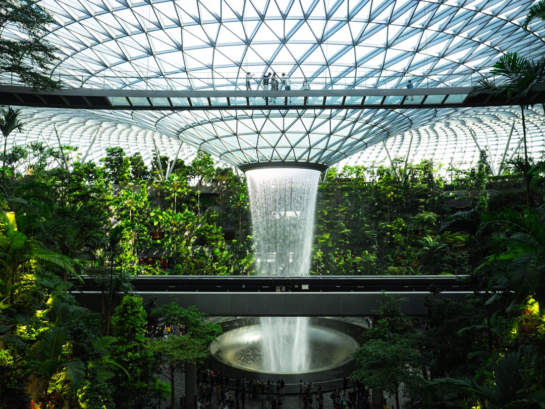 a large glass dome with a fountain in it