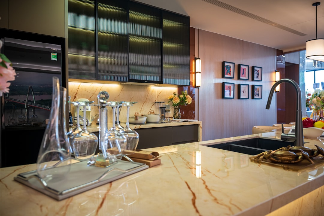 Modern kitchen with marble island and stainless steel cabinets