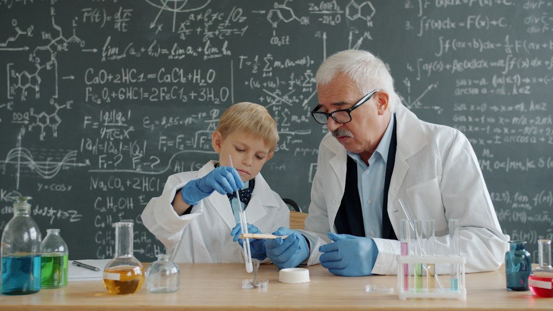 Teacher and student conducting science experiment in classroom