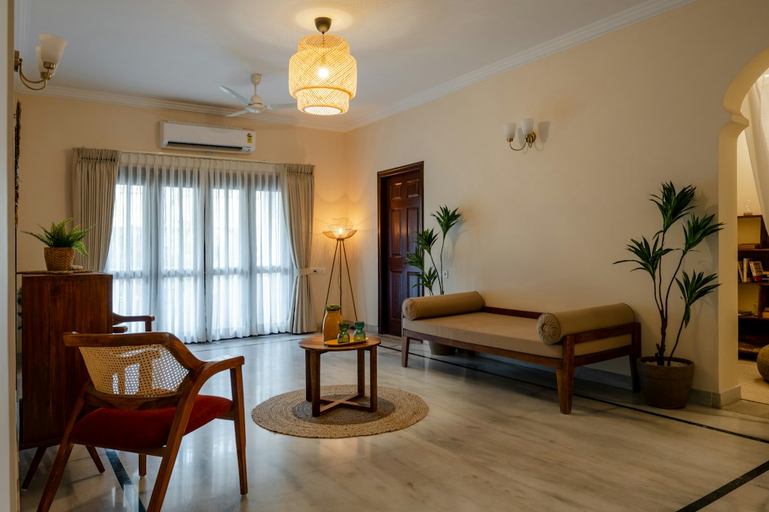 a living room filled with furniture and a window
