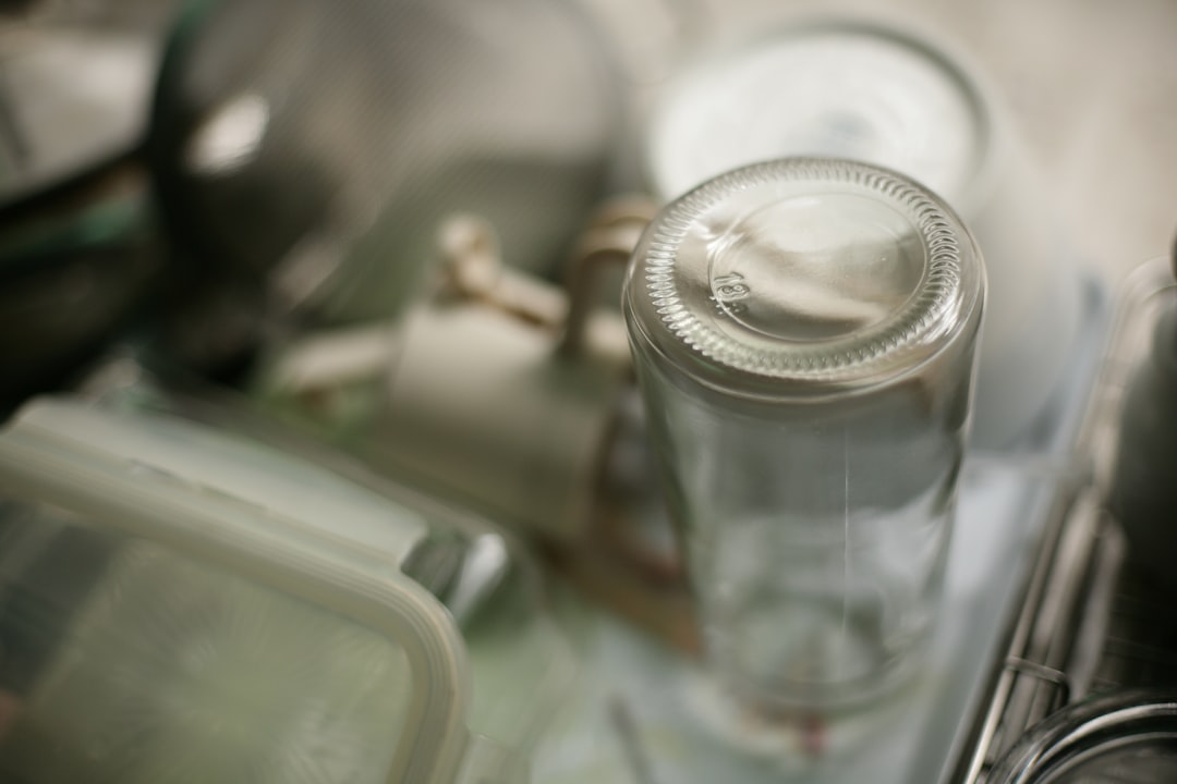 Close-up of an empty glass bottle on a shelf