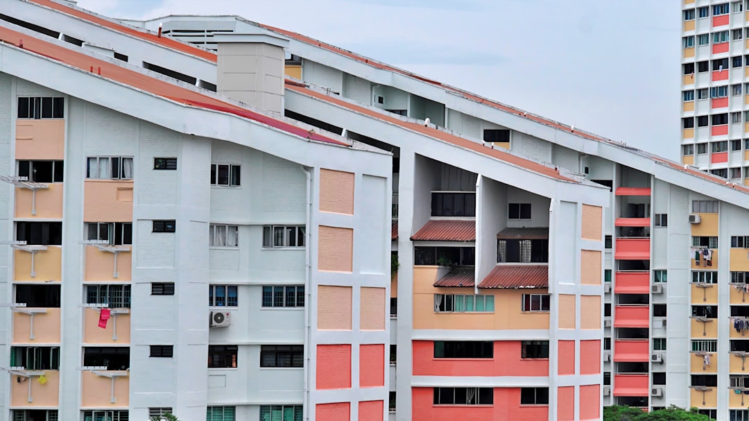 a tall building with many windows and balconies