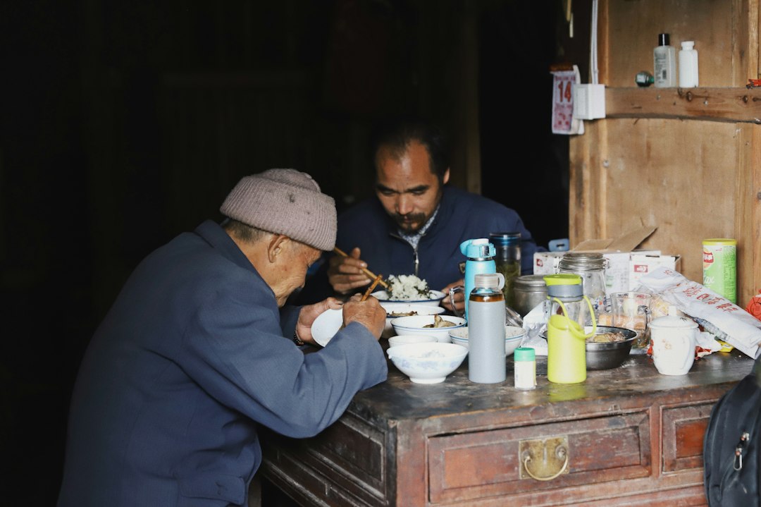 two men eating at the table