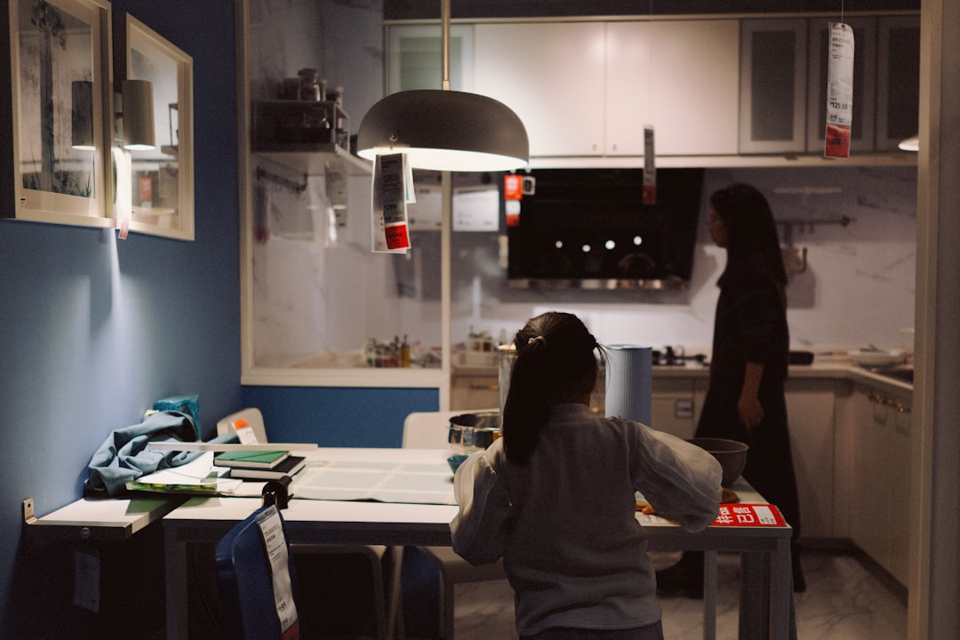 Two people in a modern kitchen setting.