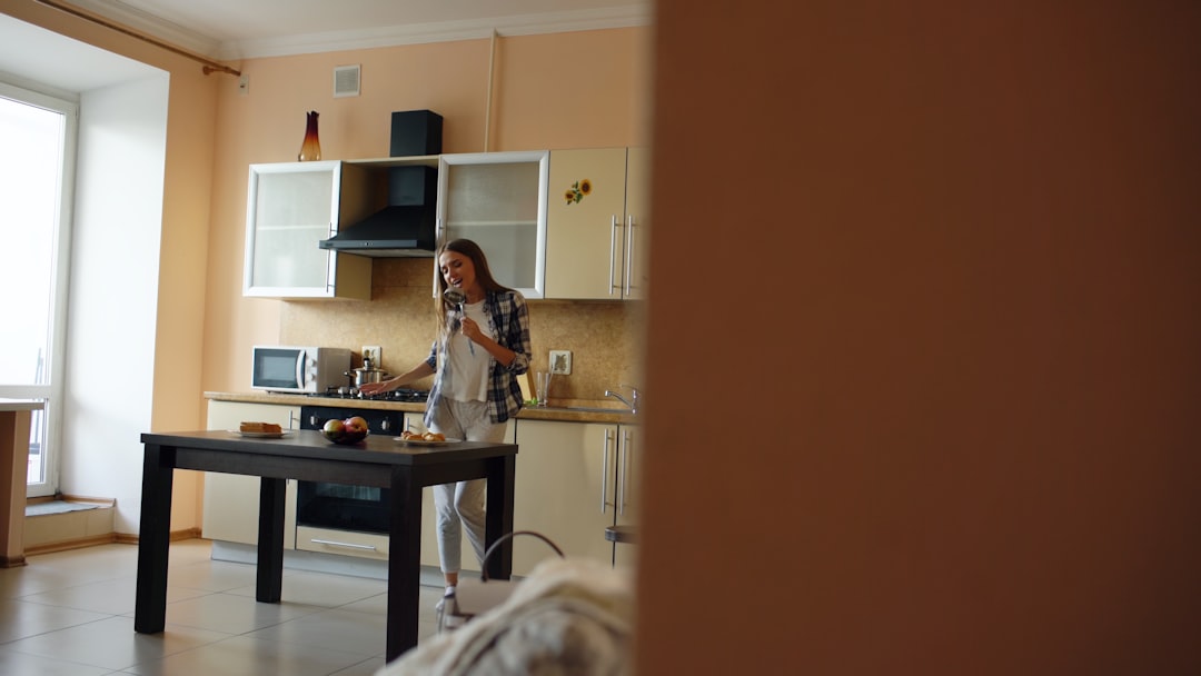 Woman talking on phone in a kitchen