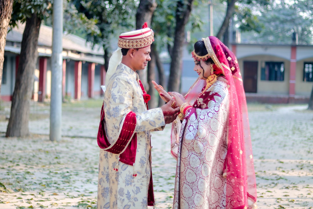 A bride and groom in traditional wedding attire