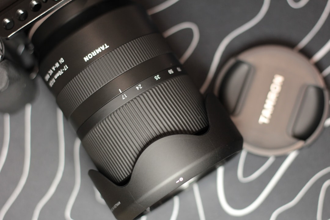 A black tamron camera lens with a lens cap.