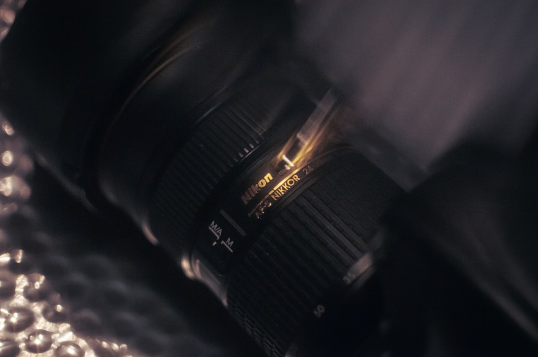 Close-up of a camera lens with gold accents.