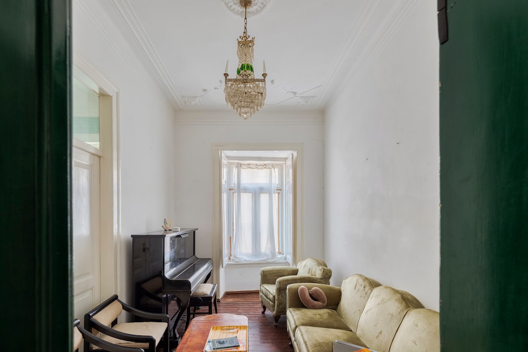 A living room with a piano and sofa