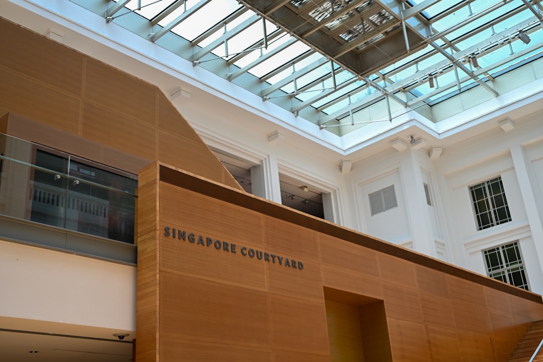 Interior courtyard with wooden walls and glass ceiling.