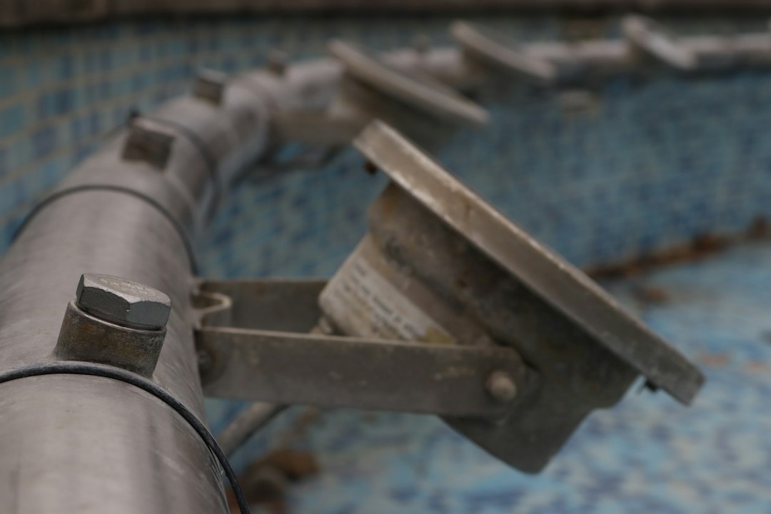 A close up of a metal object on a tiled surface
