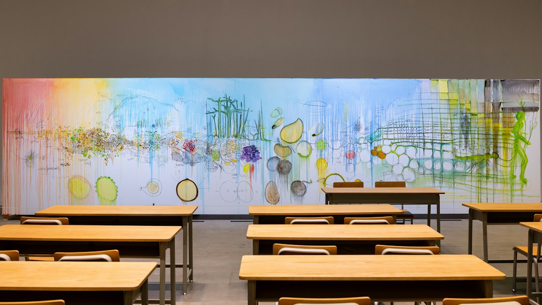 Empty classroom with a colorful mural on the wall