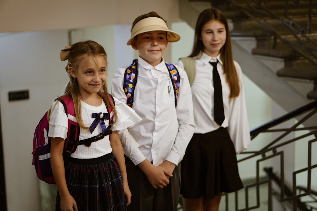 A group of young children standing next to each other