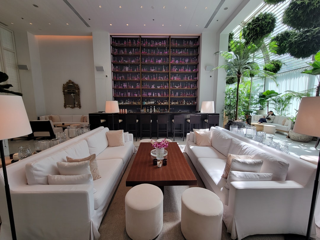 A living room filled with lots of white furniture