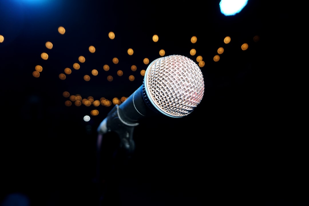 Microphone on a stage, ready to perform.