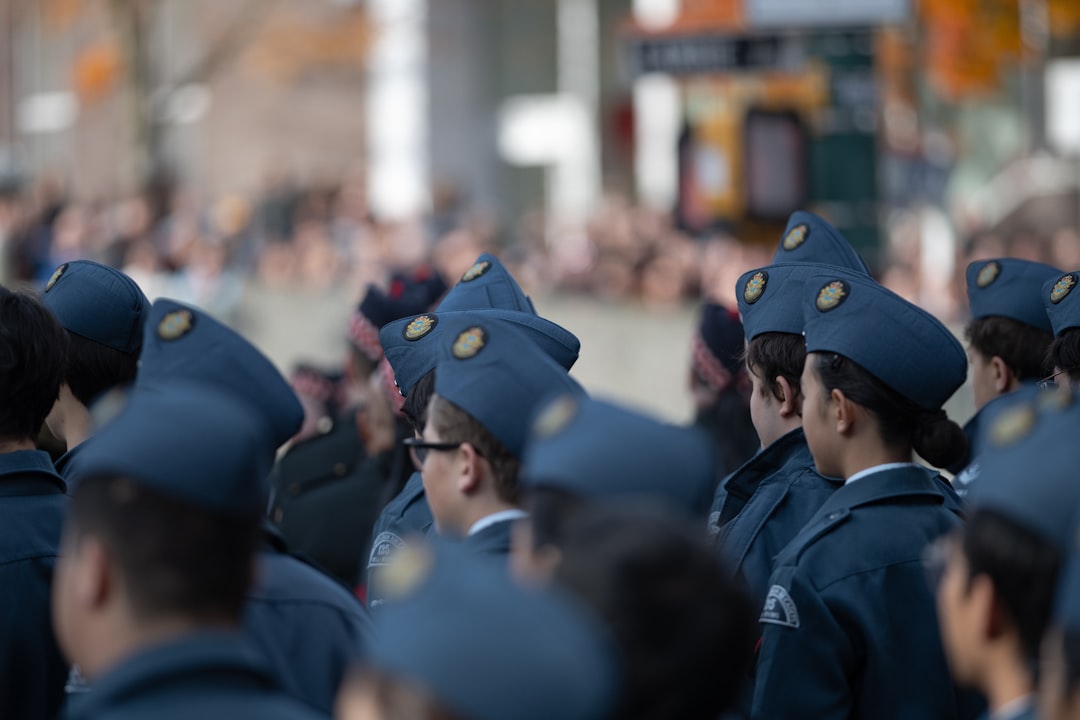 Group of people in blue hats and uniforms