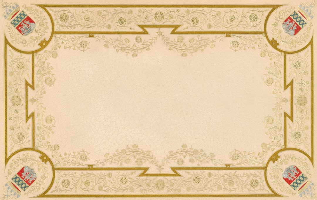 Ornate gold border with crests on a cream background.