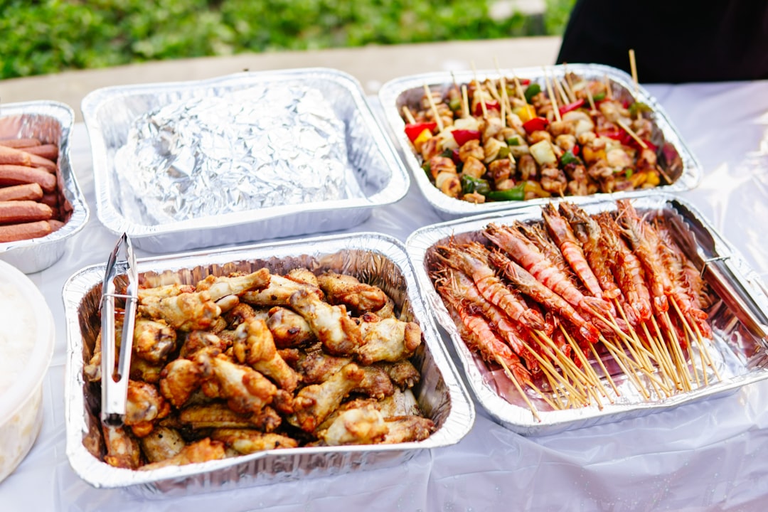 A table topped with lots of trays of food