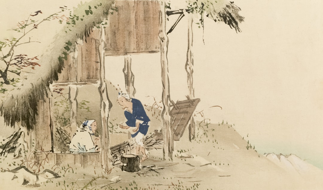 Two people by a rustic wooden structure