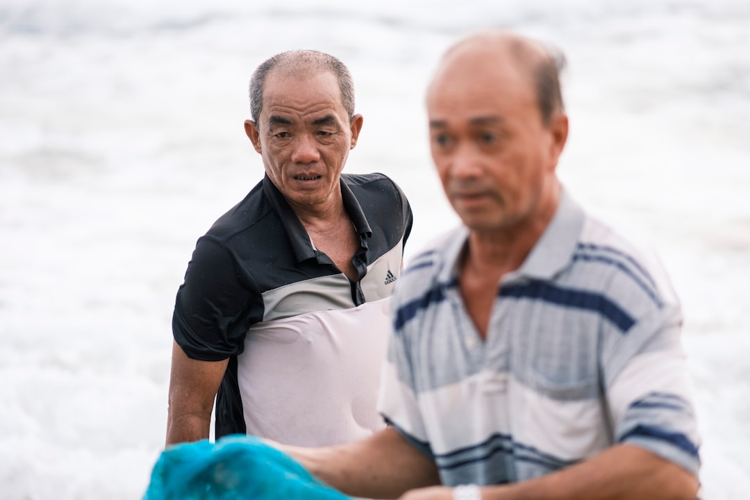 a couple of men standing next to each other
