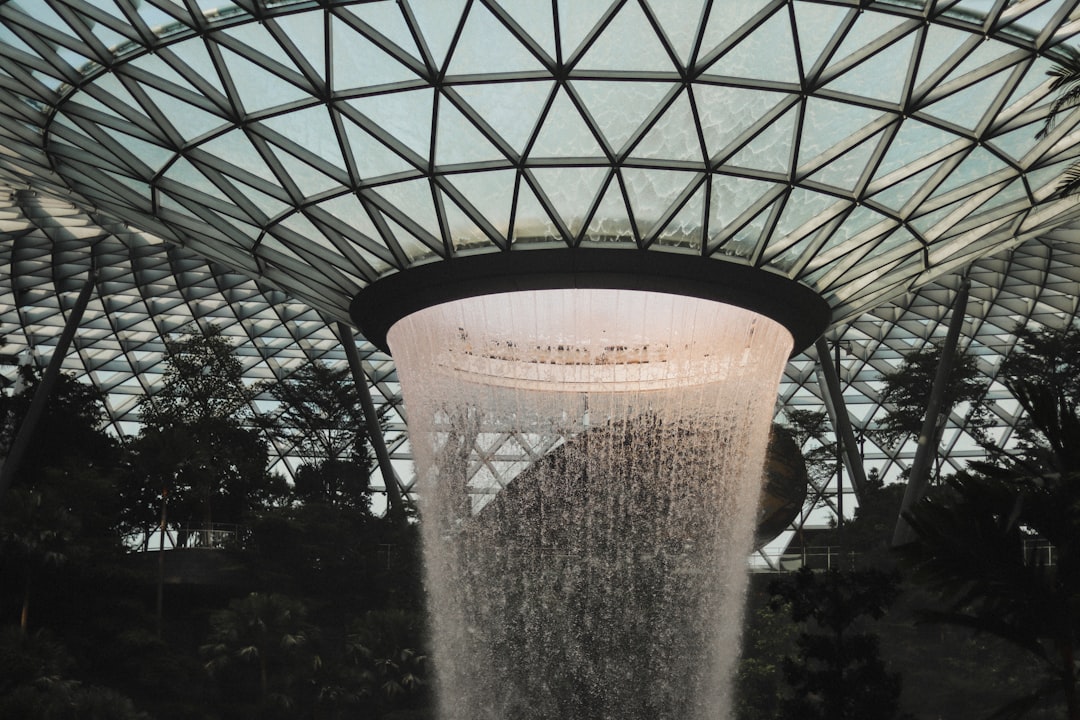 a water fountain inside of a large building