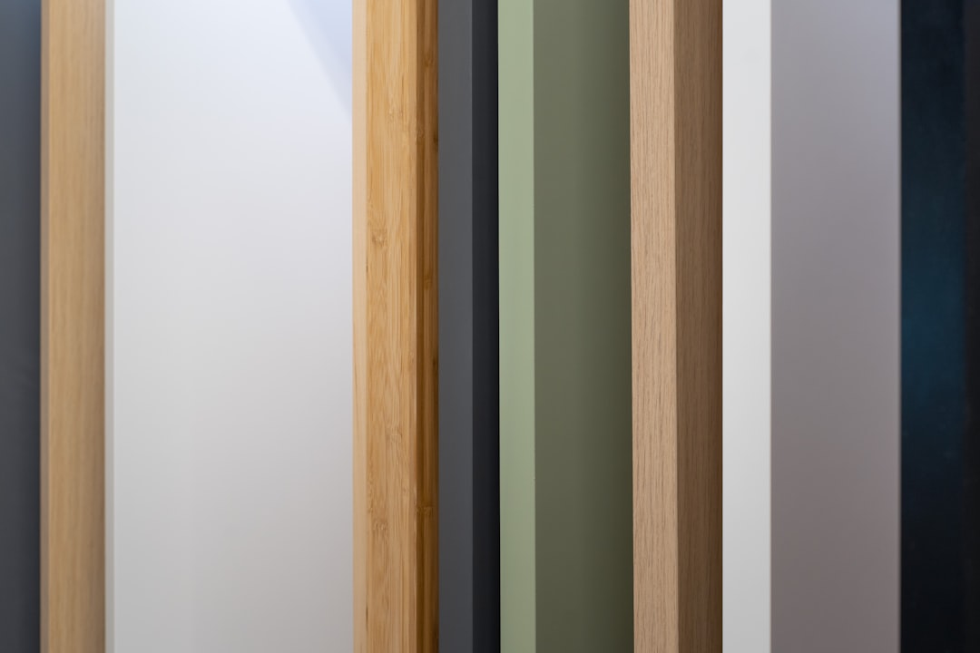 a close up of a wooden door with different colors