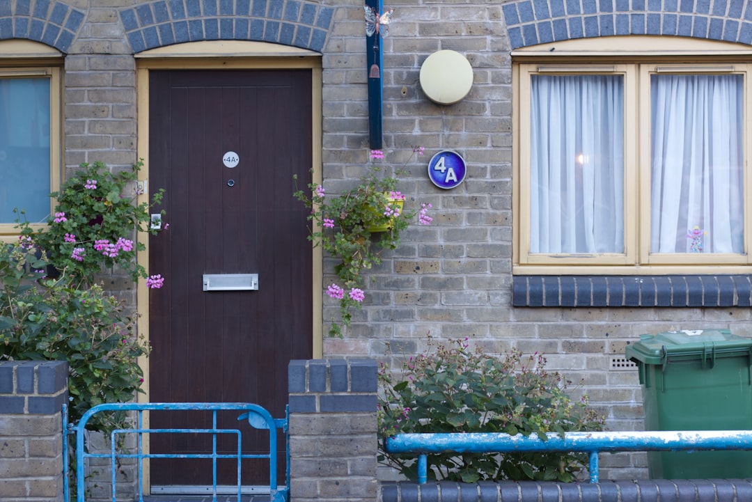 Brown door and window on brick building.