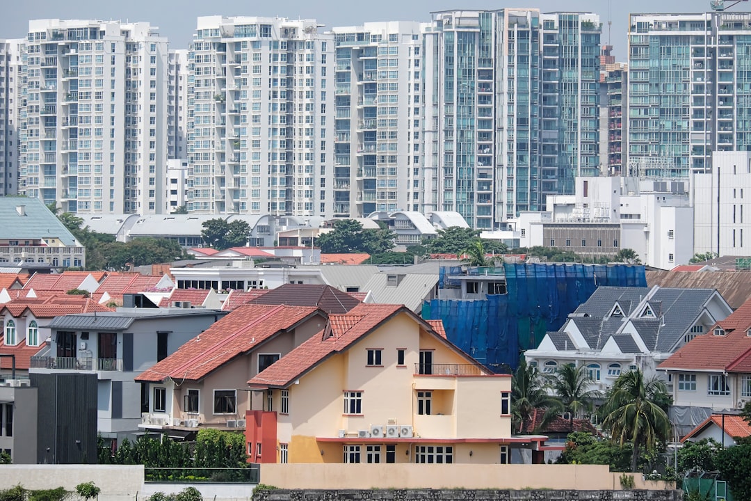 a group of buildings with trees in the front