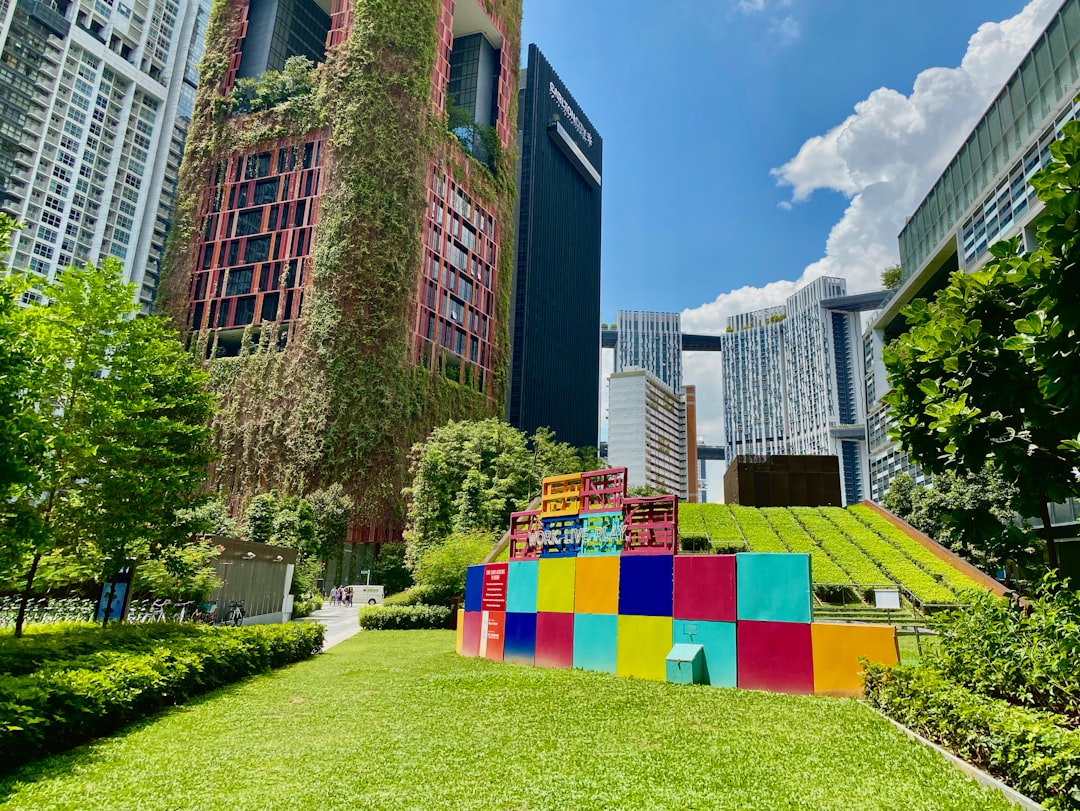 brown concrete building with green grass lawn