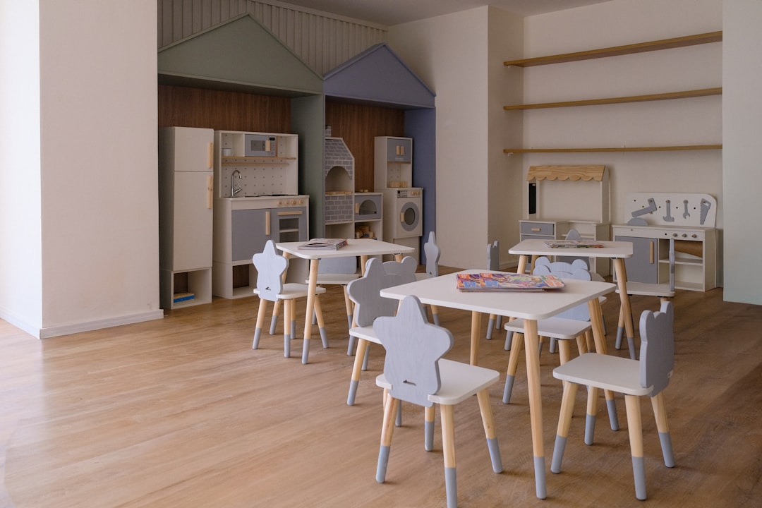 Children's playroom with small tables and chairs.